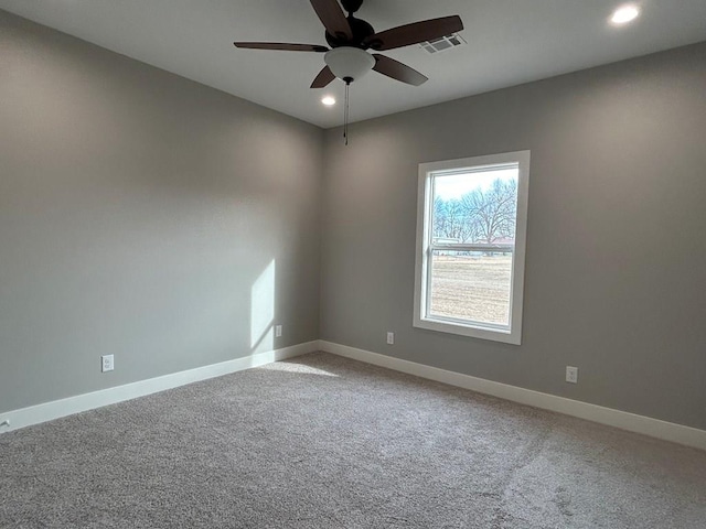 carpeted empty room with ceiling fan