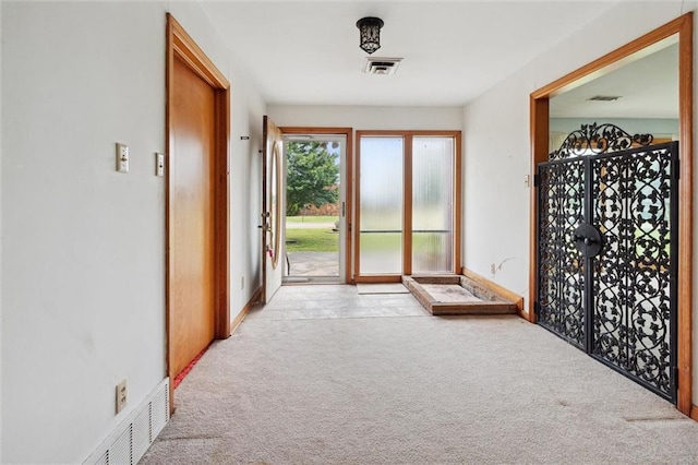 interior space featuring light colored carpet