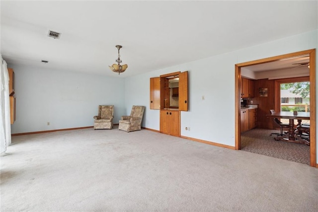 unfurnished room with light colored carpet