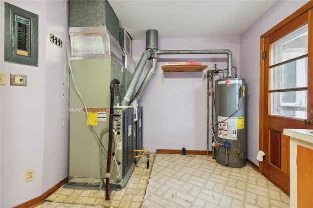 utility room with heating unit and gas water heater