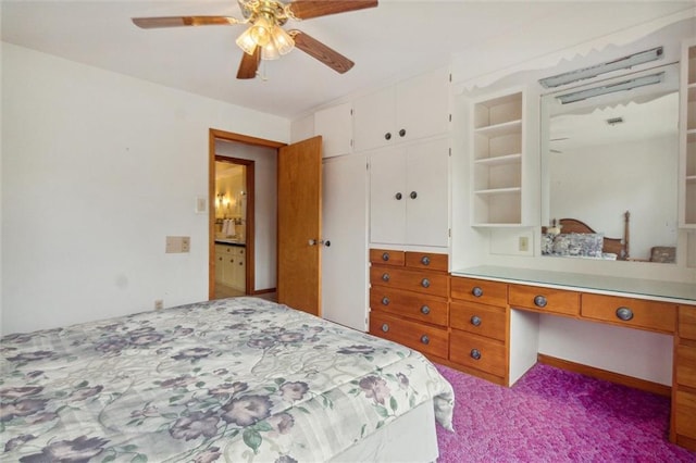 bedroom with light carpet, built in desk, a closet, and ceiling fan