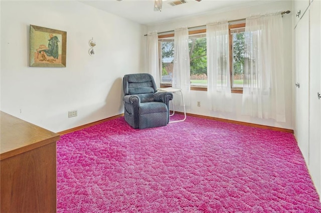 sitting room with carpet floors and ceiling fan