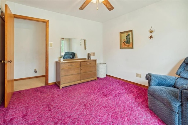 living area featuring ceiling fan and carpet flooring