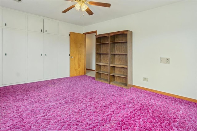 unfurnished bedroom featuring carpet floors, ceiling fan, and a closet