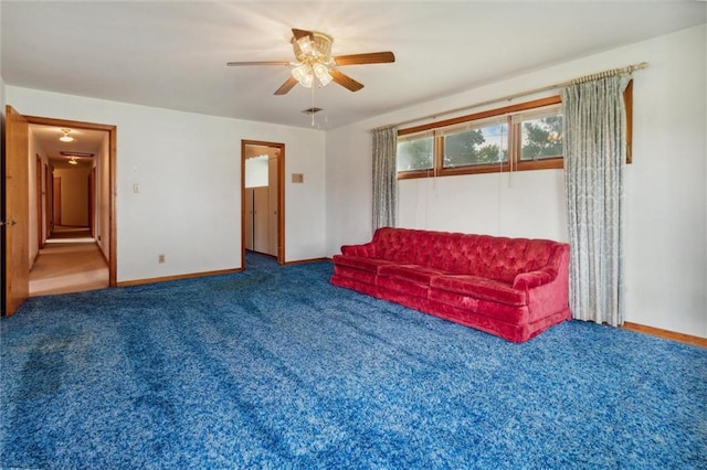 living room featuring carpet flooring and ceiling fan