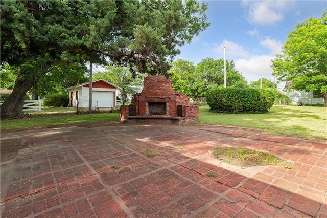 view of patio featuring an outdoor stone fireplace