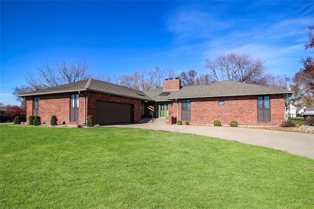 ranch-style house featuring a front lawn and a garage