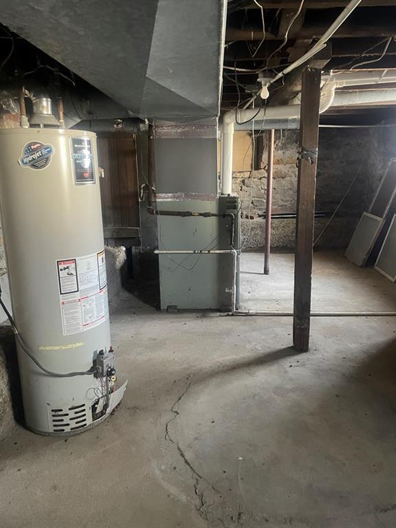 basement with heating unit and water heater