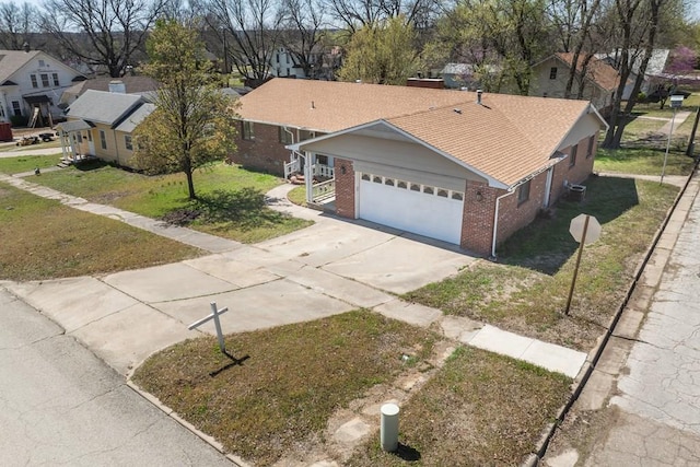 ranch-style home with a front yard and a garage