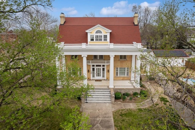 neoclassical / greek revival house with covered porch