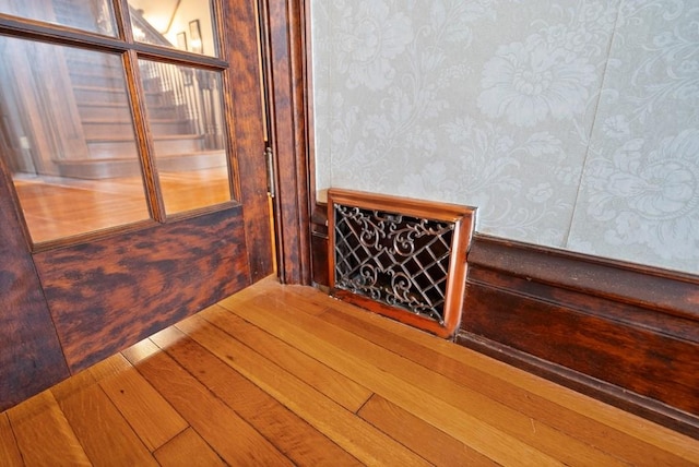 stairway featuring hardwood / wood-style floors