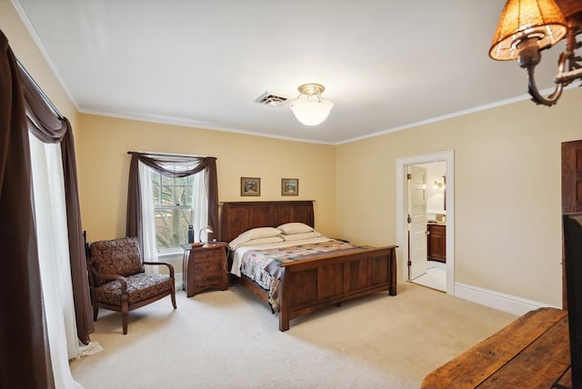 carpeted bedroom featuring ornamental molding and ensuite bathroom