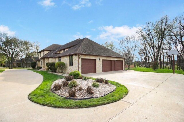 view of home's exterior with a yard and a garage