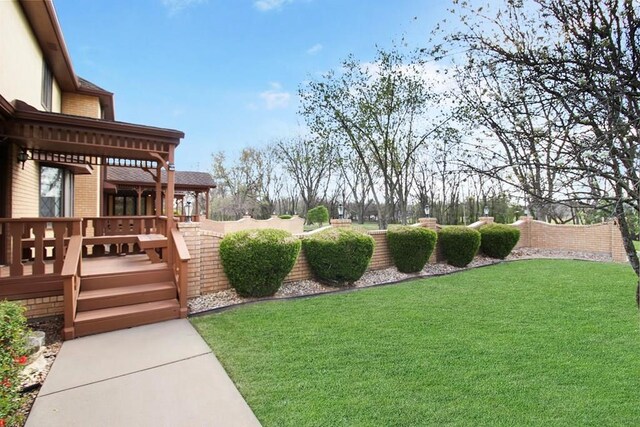 view of yard featuring a wooden deck