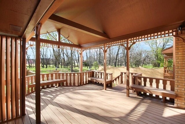 wooden deck featuring a gazebo