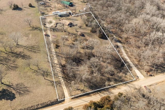 birds eye view of property with a rural view