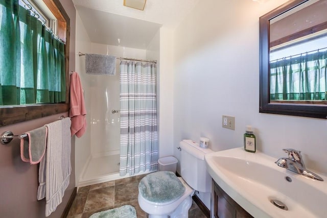 bathroom featuring walk in shower, sink, tile flooring, and toilet