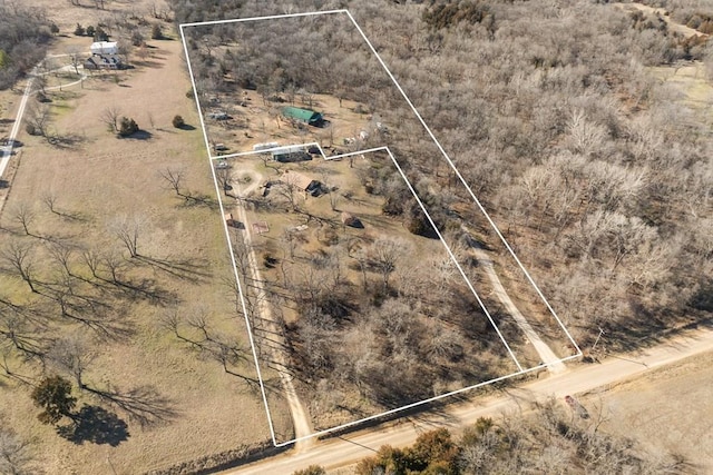 birds eye view of property with a rural view