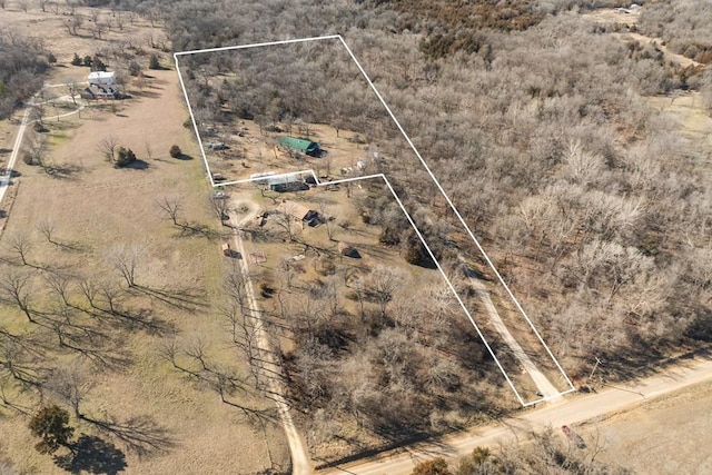 birds eye view of property with a rural view