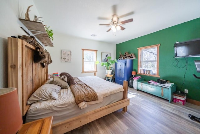 bedroom featuring ceiling fan and hardwood / wood-style flooring