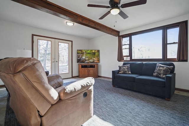 living room featuring ceiling fan, french doors, and beamed ceiling