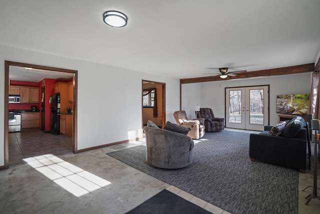 living room featuring ceiling fan and french doors