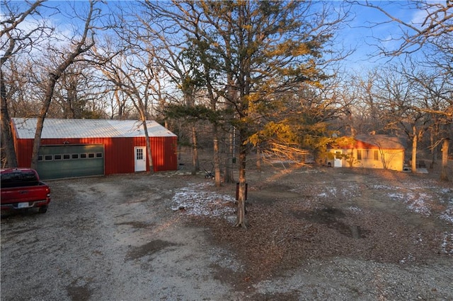 exterior space with an outbuilding and a garage