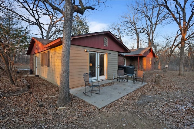 rear view of property featuring a patio