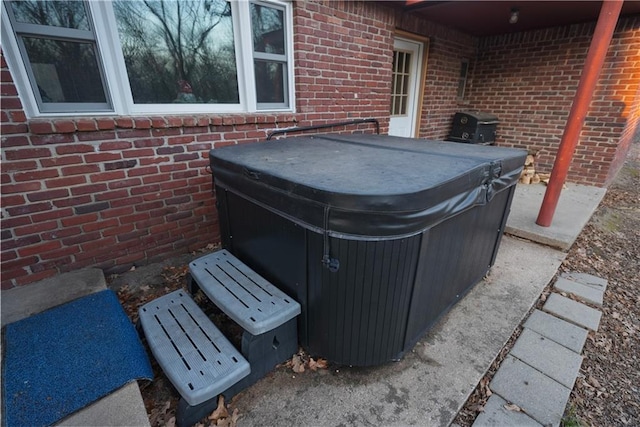 view of patio / terrace with a hot tub