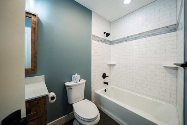 full bathroom featuring toilet, tiled shower / bath combo, and vanity