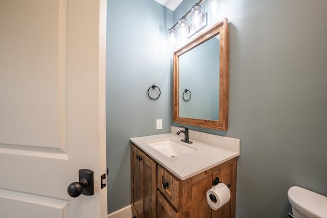 bathroom with vanity and toilet