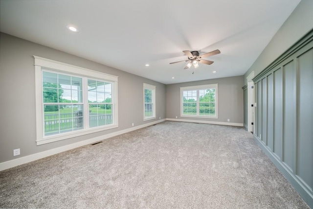 carpeted empty room with ceiling fan