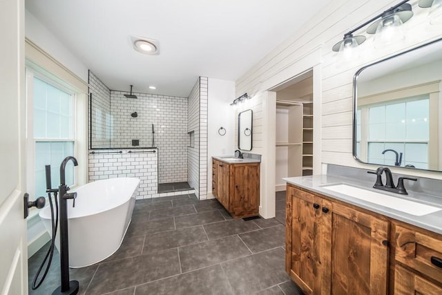 bathroom featuring vanity, a healthy amount of sunlight, separate shower and tub, and tile patterned floors