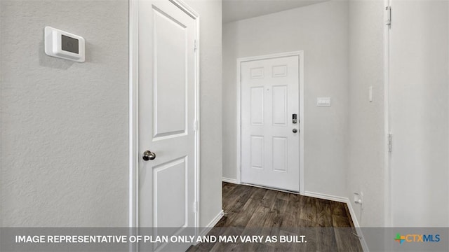 hallway with dark hardwood / wood-style floors