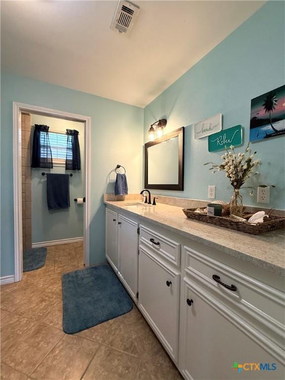 68 Silkstocking St, Port Lavaca, TX 77979 - full bath featuring vanity, tile patterned flooring, and baseboards
