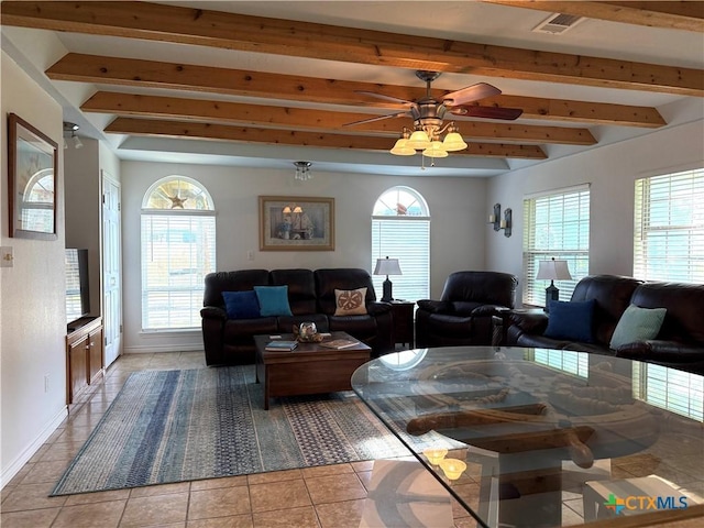 68 Silkstocking St, Port Lavaca, TX 77979 - living room featuring beamed ceiling, light tile patterned flooring, ceiling fan, and baseboards