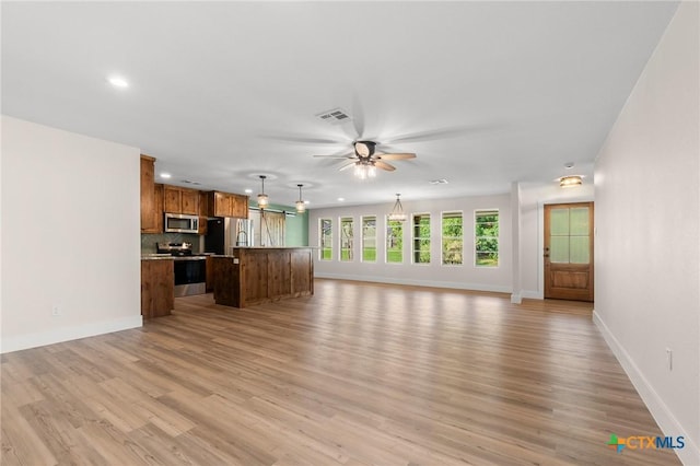 unfurnished living room with visible vents, baseboards, ceiling fan, recessed lighting, and light wood finished floors