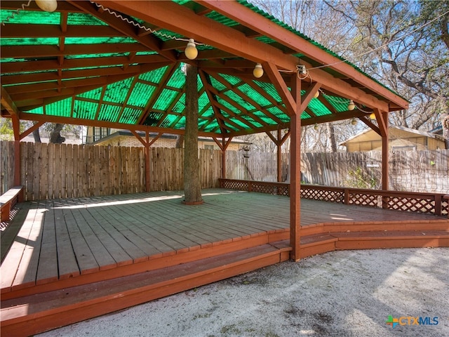 deck with a gazebo and fence