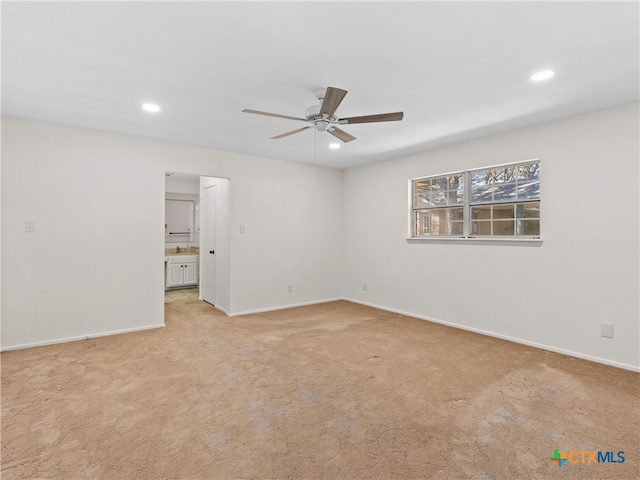 unfurnished room featuring light carpet, baseboards, a ceiling fan, and recessed lighting