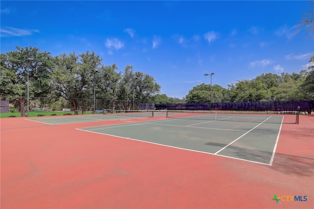 8302 Dove Valley Cv, Austin, TX 78729 - view of tennis court featuring community basketball court and fence
