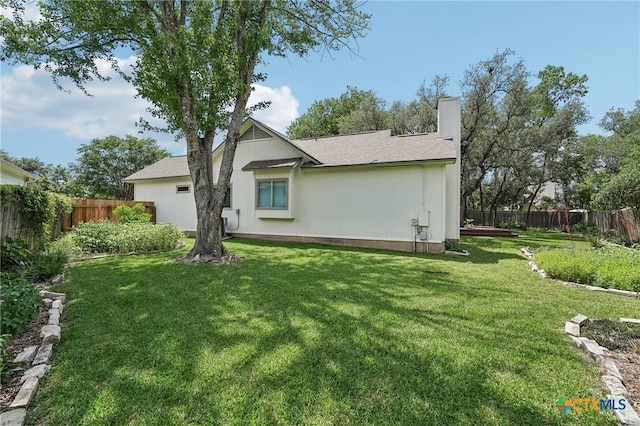 8302 Dove Valley Cv, Austin, TX 78729 - back of property featuring a chimney