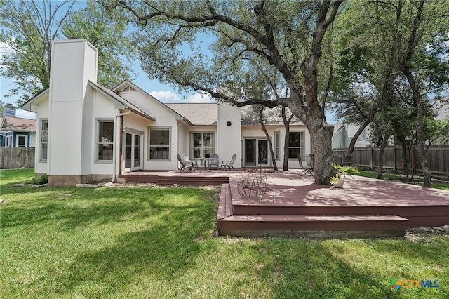 8302 Dove Valley Cv, Austin, TX 78729 - back of house featuring a chimney and a deck