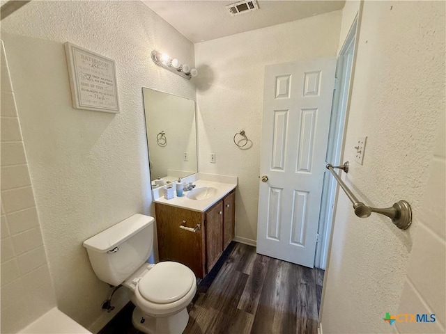 3807 Sunflower Dr, Killeen, TX 76542 - bathroom with vanity, wood finished floors, and a textured wall