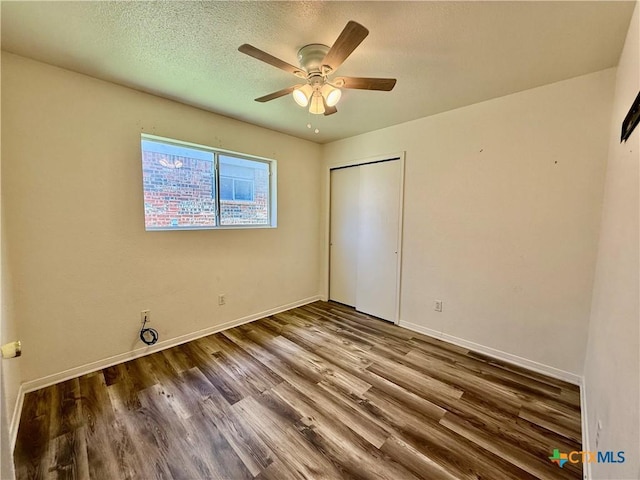 3807 Sunflower Dr, Killeen, TX 76542 - unfurnished bedroom with wood finished floors, a closet, and a ceiling fan