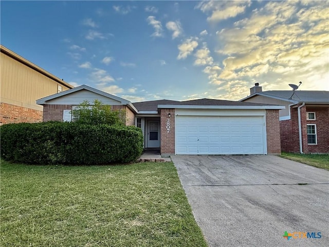 3807 Sunflower Dr, Killeen, TX 76542 - ranch-style home featuring brick siding, an attached garage, driveway, and a front yard