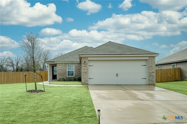 single story home featuring a front lawn and a garage