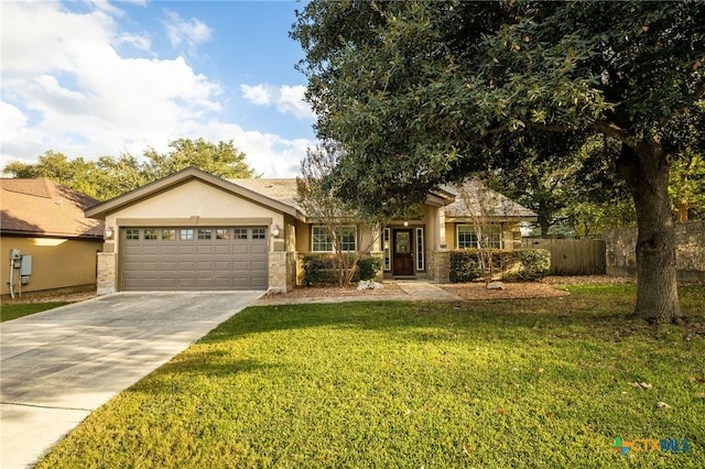 view of front of property with stucco siding, a front yard, fence, a garage, and driveway