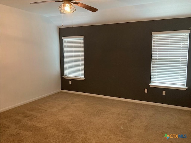 212 Dusky Thrush Dr, Kyle, TX 78640 - empty room featuring carpet, a ceiling fan, and baseboards