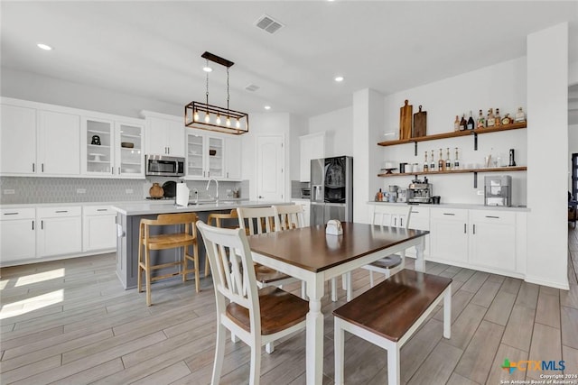 dining area featuring sink