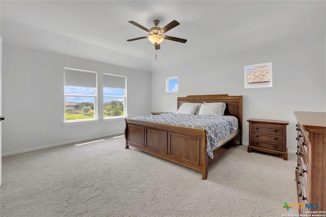 bedroom with ceiling fan and light colored carpet